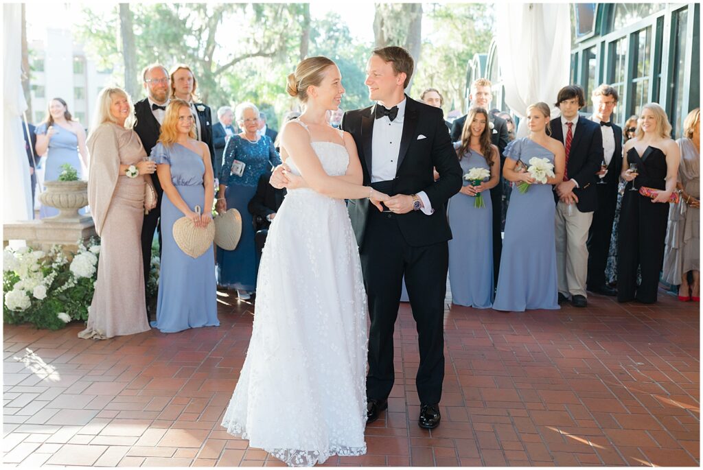 Husband and wife first dance at their outdoor country club wedding.